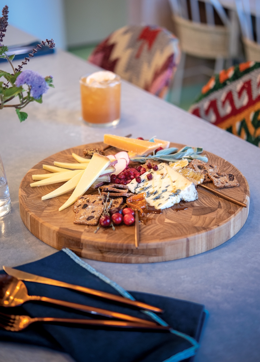 This board from Plenty Mercantile holds The Kitchen at Commonplace’s Bayley Hazen Blue cheese from Jasper Hill Farms, Brabander gouda, La Quercia speck, salame, honeycomb, house-made orange marmalade.