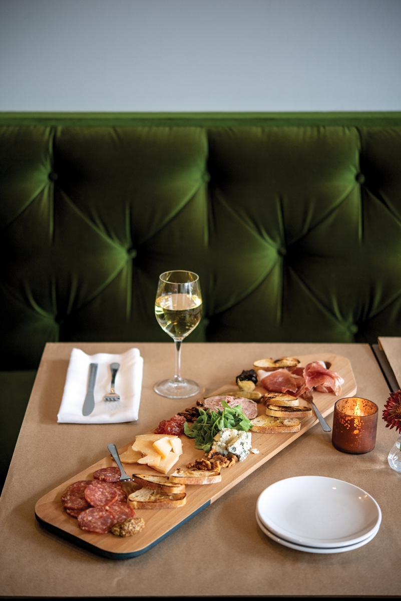 The Pritchard’s Prosciutto di Parma paired with house-made fig caramel, pheasant pate with house-made candied pecans, spicy salame with whole grain mustard, Italian gorgonzola cheese with roasted walnuts, Ewephoria cheese from The Netherlands with house-made apple pie jam, plus arugula, house-made pickled okra and toasted crostini, on a board from Culinary Kitchen.