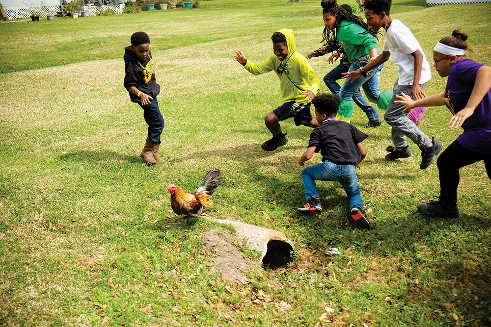 Kids scramble after the chicken during the Chicken Run parade in Iowa, Louisiana. Photo courtesy Shreveport CVB
