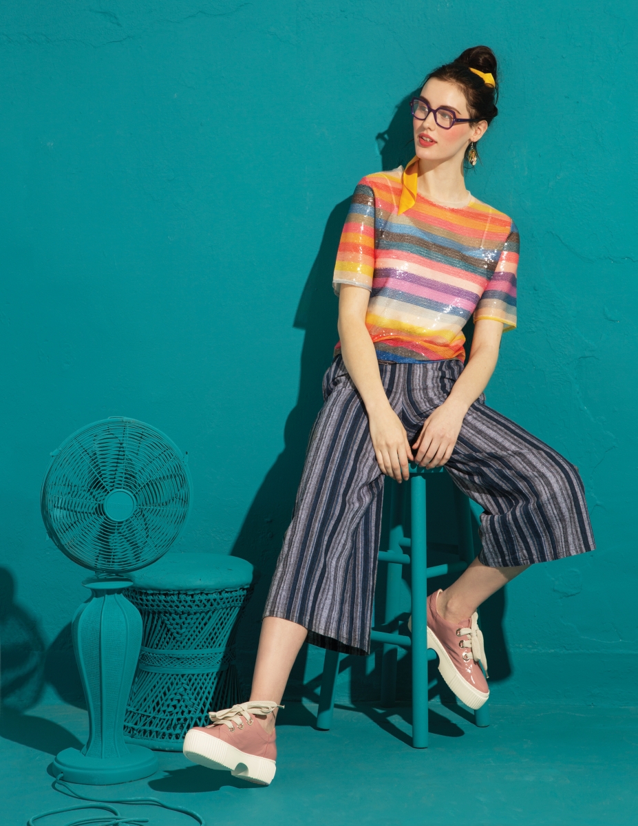 Hesperus rainbow sequin striped shirt and Reset by Jane Best Bodysuit Ever in ivory from The Black Scintilla; KLD wide legged striped pant with belt and scrunchie ribbon in mustard from Siempre Viva; Attilio Giusti Leombruni sneakers in flower milk from Balliets; Anne & Valentin O Feel glasses from TSO Optical