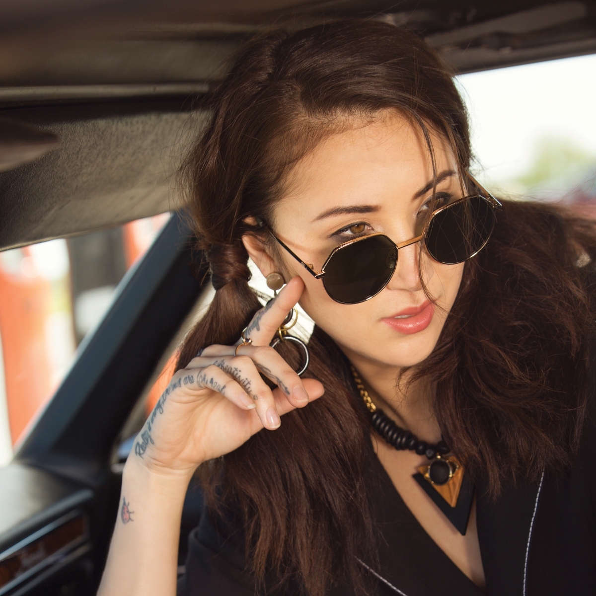 Moon River black jumpsuit, Shelly Dahari necklace, Soko brass and horn earrings, Soko channel ring and Seaworthy tiger’s eye indigo ring from Rosegold; vintage leopard belt from Library; Fendi sunglasses from Physician’s Optical