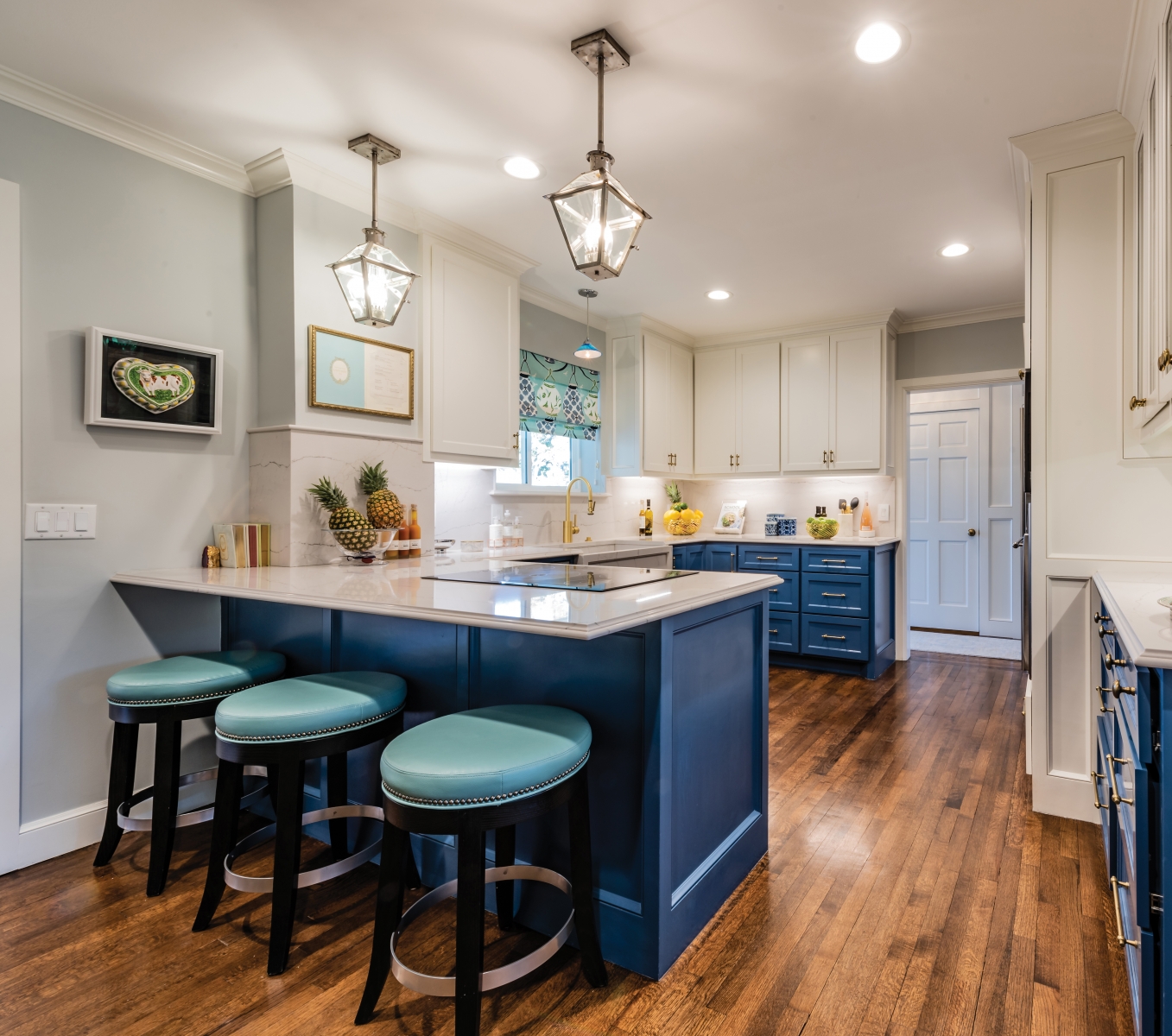 More blue, white and gray in the kitchen are at once very traditional and very fresh-feeling. “The original kitchen was tiny,” Amy says. “Half of it was a breakfast room. We took out a wall, but I wanted to keep traditional rooms – we didn’t want to completely open the floorplan – so we didn’t blow out the back. We just gave ourselves a little more space.”