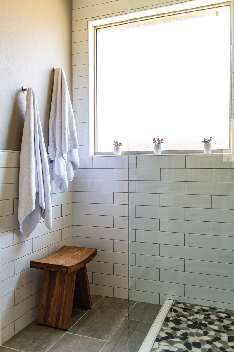 Mark says, “My favorite design element is definitely the master bath. I wanted to keep the natural light, so we came up with the idea to get rid of the tub, extend the shower and put a huge frameless glass in there.”