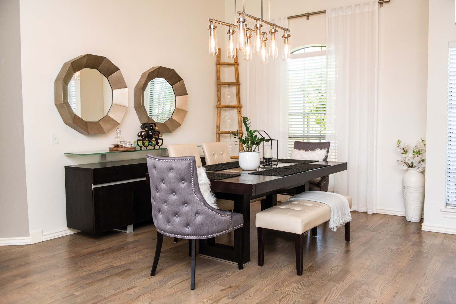 “I’m glad we have a formal dining room,” says Mark. “We use it during the holidays or when we have parties. It’s like a piece of art – great to look at, but we don’t use it that often.” The mix of neutral shades and predominance of wood textures is carried throughout the home, and allows decorative elements to stand out.