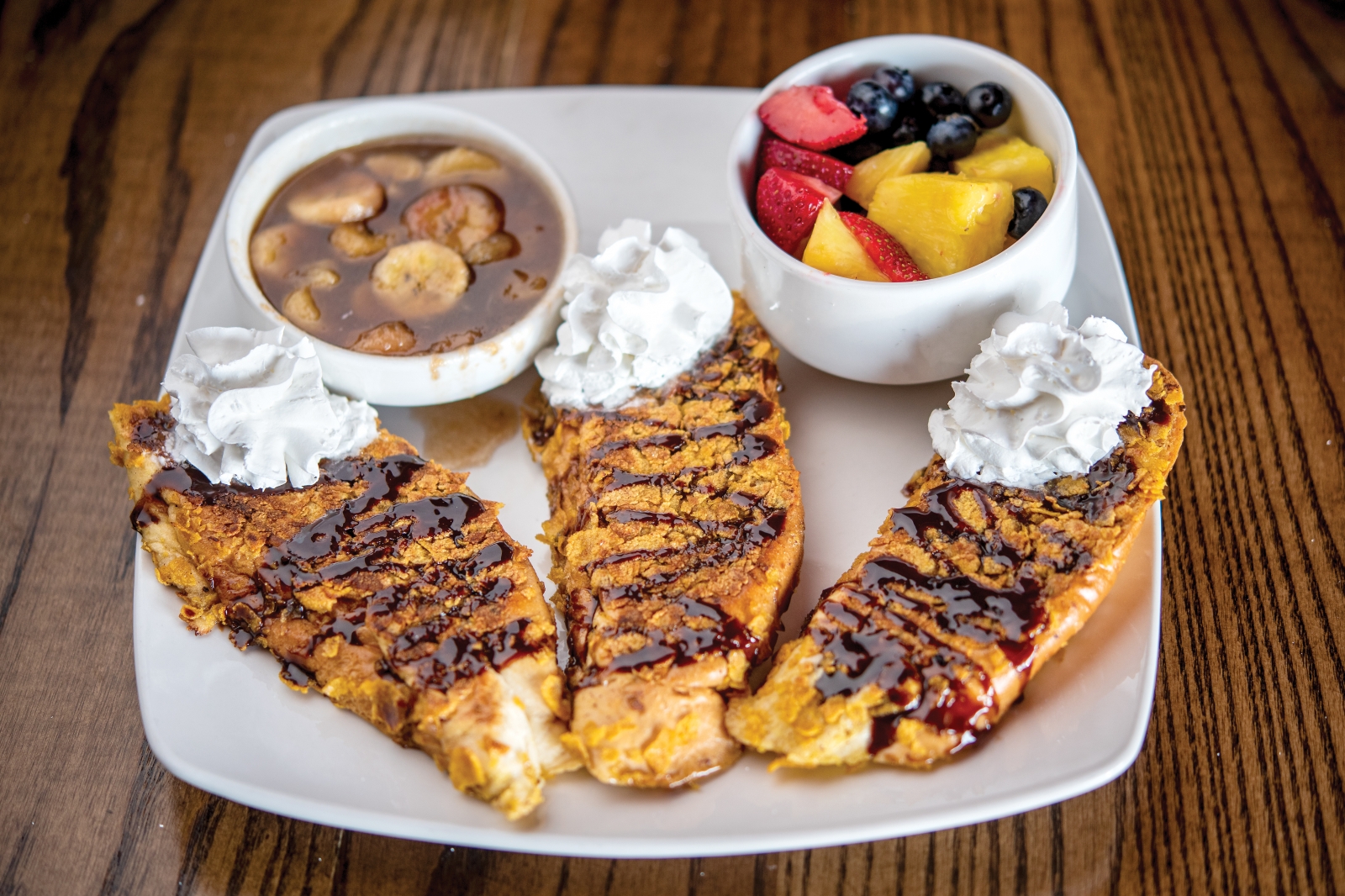 The Crunchy French Toast gets its snap from Cuban bread crusted with cornflakes, and its sweetness from Mexican chocolate and caramelized bananas.
