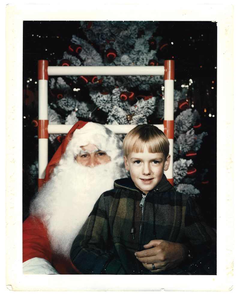 A young 405 Magazine writer on Santa’s lap at Edmond Plaza TG&Y