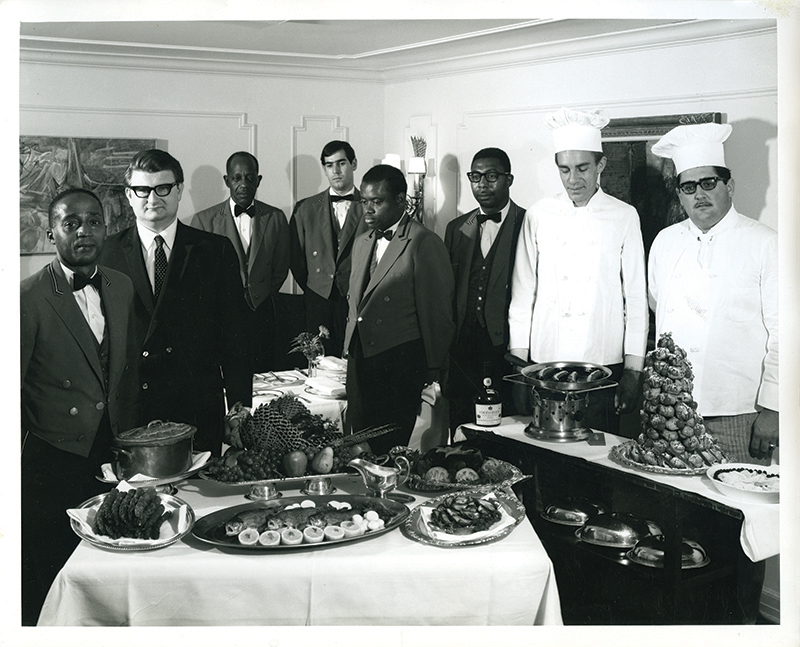 Chef John Bennett (second from left) and a staff of skilled cooks and waiters created marvelous dining experiences in The Cellar at Hightower, a culinary jewel beneath its namesake building.