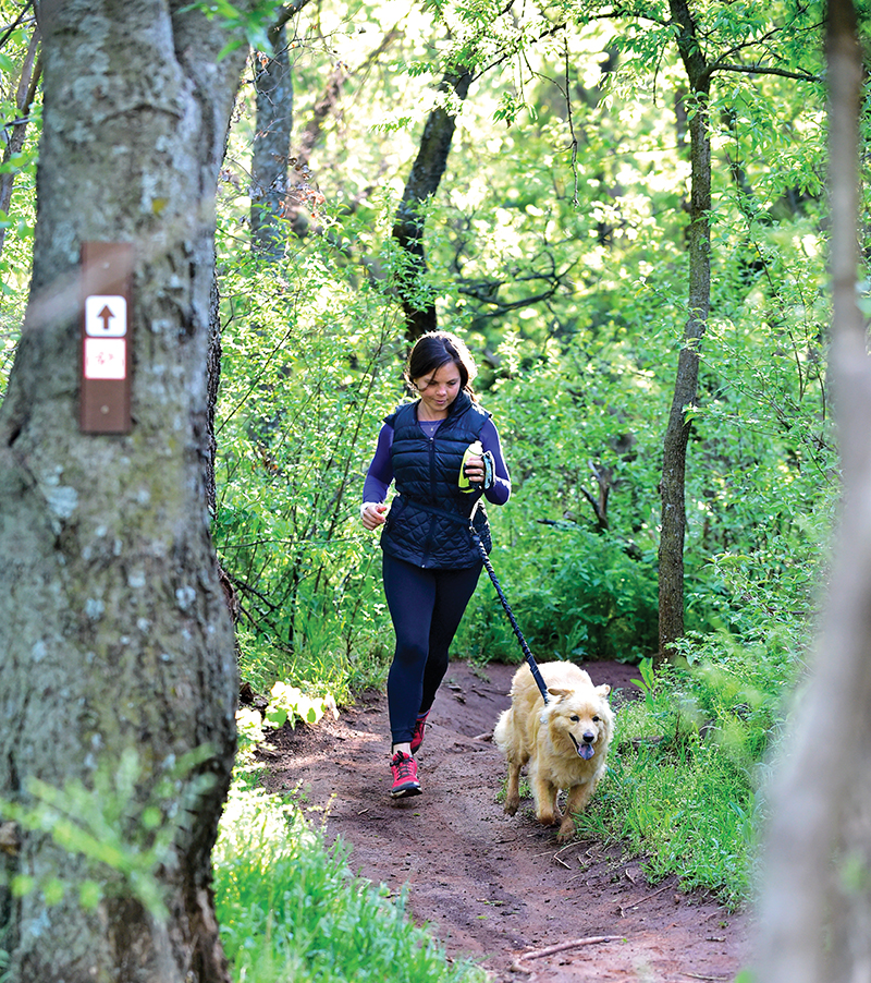 Adi McCasland gets a morning workout alongside her pal Murray.