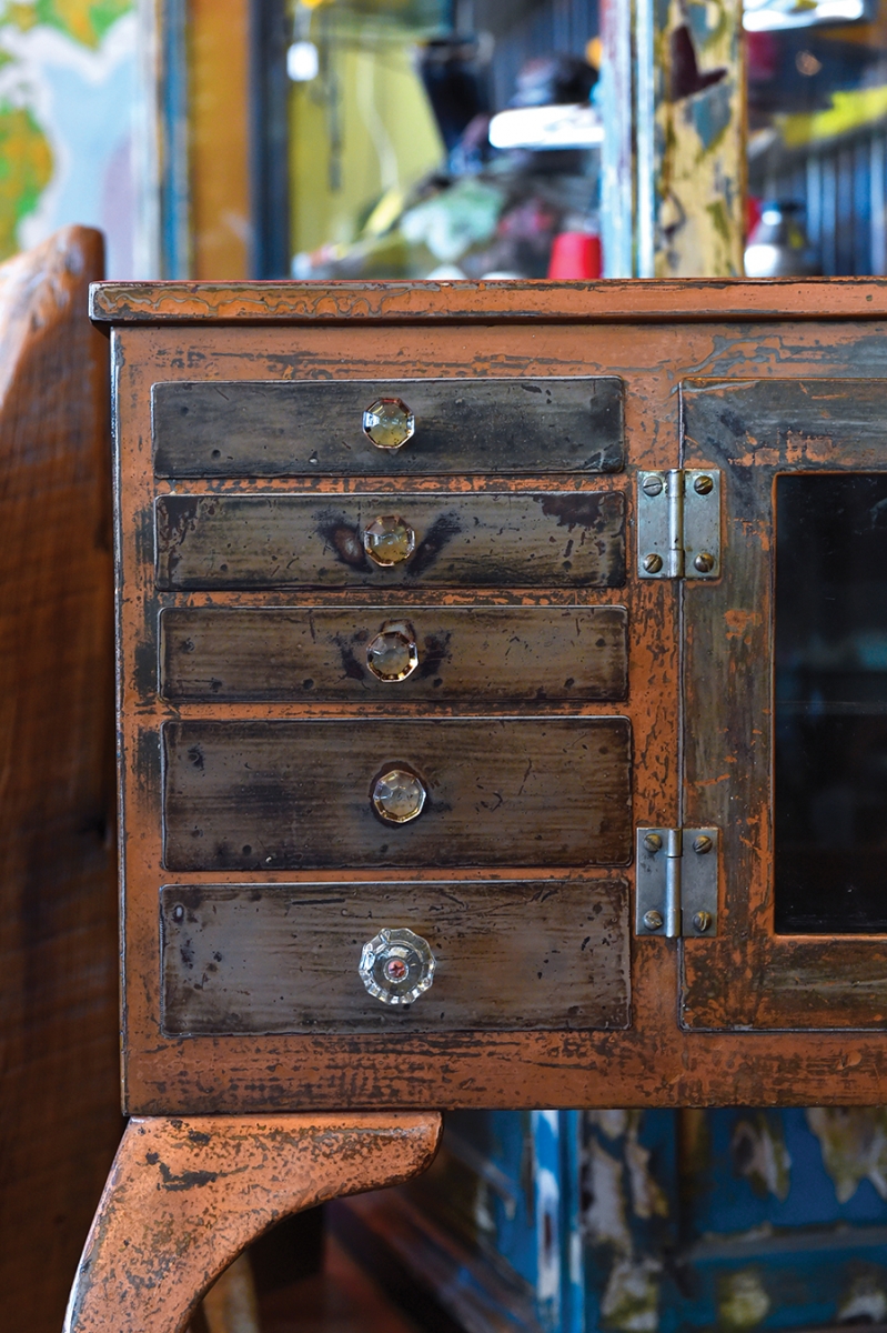 The knobs are mismatched and the paint discolored, but this metal cabinet created by Matt Parsons is a beauty nonetheless.