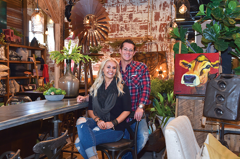 Urban Farmhouse Designs owners Cherami and Jason Thomas amid several examples of their unique wares.