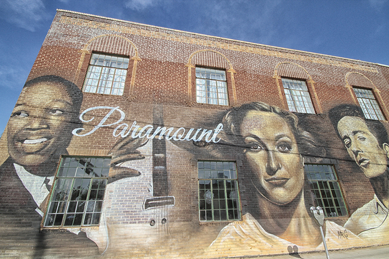 Oklahoma icon mural series on the Paramount featuring Charlie Christian, Joan Crawford and Woody Guthrie, by Mr. G