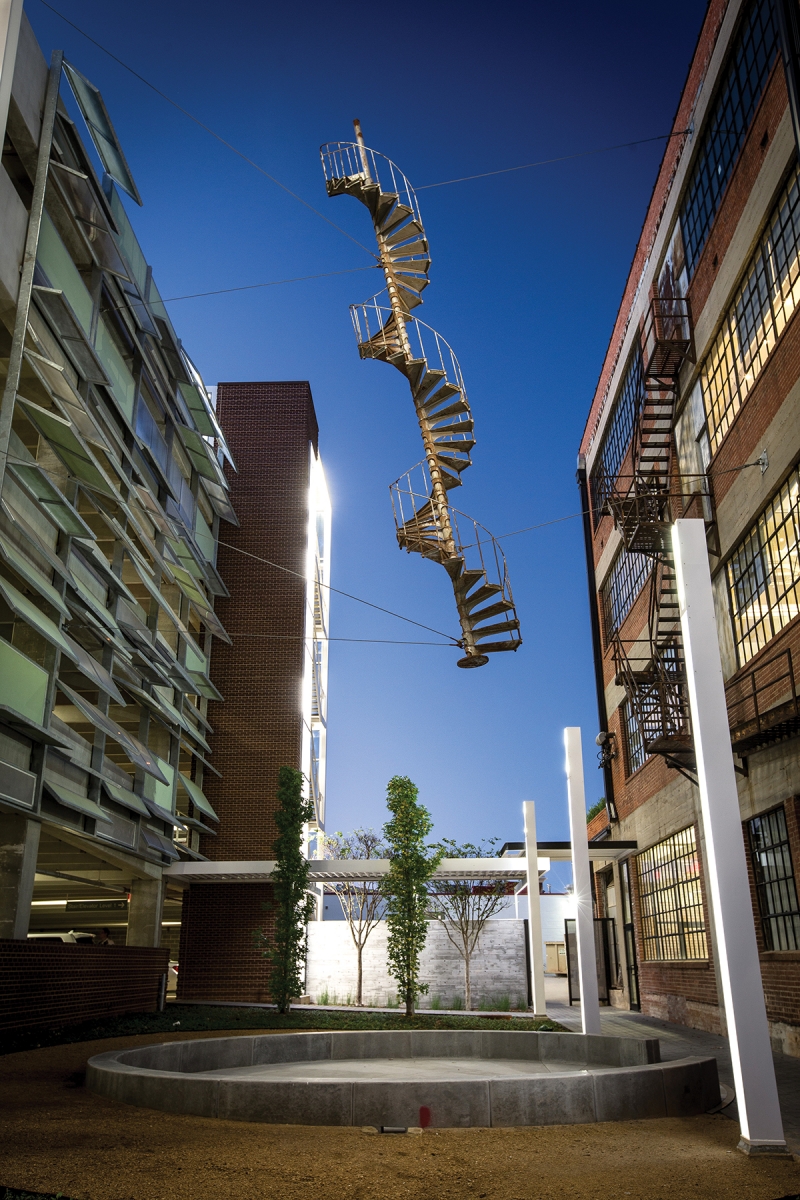 The Marion’s original fire escape now hangs suspended between the Buick Building and the parking garage to its west, serving as public art to captivate passing viewers.