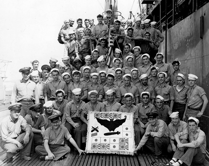The crew of the USS Batfish tallies the Japanese vessels it destroyed during World War II: the flags with the red dot represent merchant ships sunk; the Rising Sun flags represent Imperial Navy vessels torpedoed; the torpedo-riding bat is the sub mascot; the crossed torpedoes and flags on the left represent the historic 6th War Patrol, which sank three submarines in 76 hours and a merchant ship near the end of the patrol. The flag was later amended to add a designation signifying the sub received a Presidential Unit Citation.