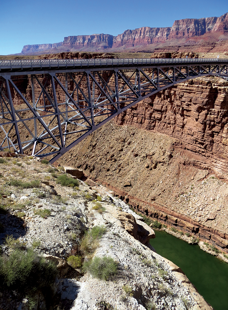 From the old Navajo Bridge, visitors get a good view of the new bridge, the Vermilion Cliffs and the Colorado River below.