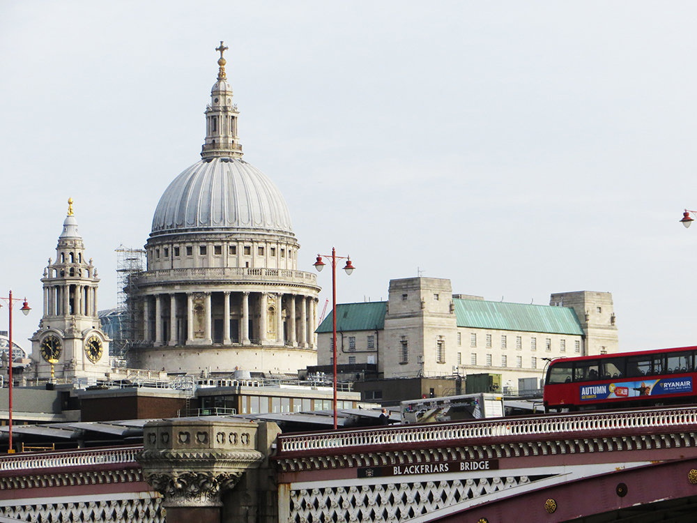 The towers and dome of St. Paul’s Cathedral are visible as the City Cruise boat approaches Blackfriars Bridge.