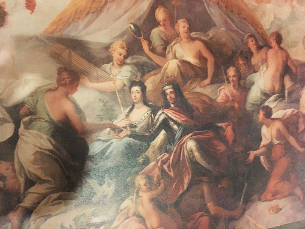 In this ceiling detail, Queen Mary II and King William III reach out to Peace. He’s difficult to see, but William’s arch-enemy, French King Louis XIV, cowers beneath William’s foot.