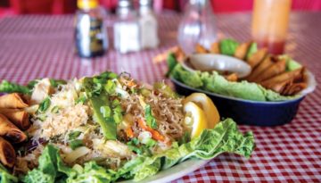 Two dishes from Chibugan in Del City, including a tray of lumpia.