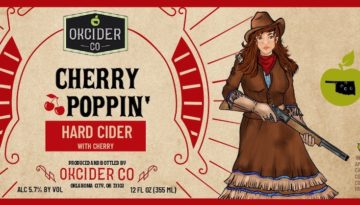 A beer label with a woman in 19th-century Western attire wears a red bandana and a cowgirl hat. She has brown hair and is holding a shotgun pointed down. The text reads, "OK Cider, Co. Cherry Poppin' Hard Cider with Cherry."