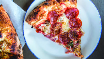 Two slices of pepperoni pizza.