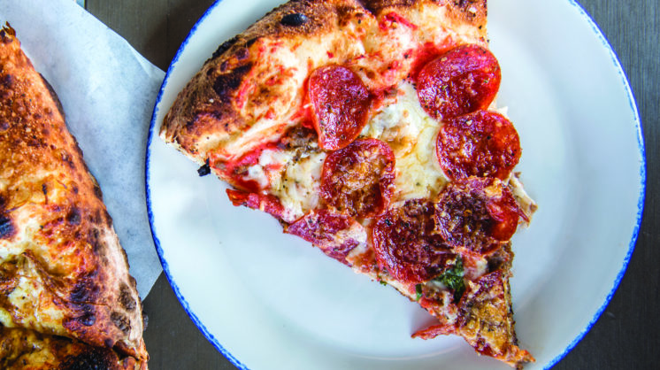 Two slices of pepperoni pizza.