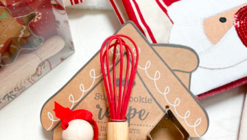 A holiday cookie baking set that includes a small whisk.