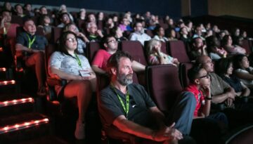 A crowd in dark movie theater watches a film at deadCenter Film Festival in Oklahoma City.