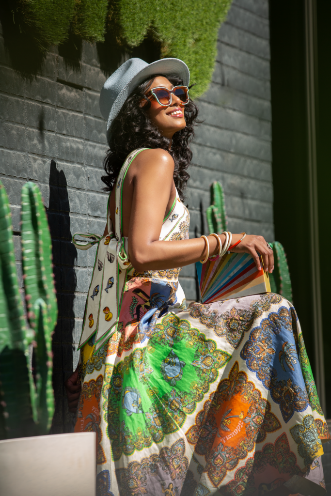 Woman in green dress with sunglasses