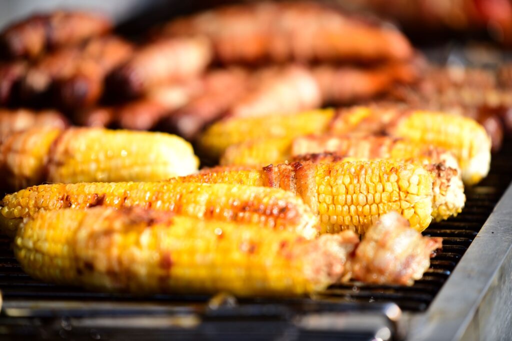 Roasted corn on a grill.