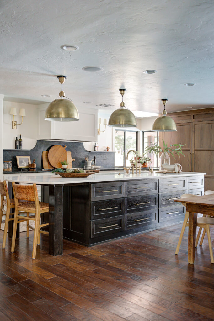 Kitchen island in an Edmond home featuring dark wood and a rustic table