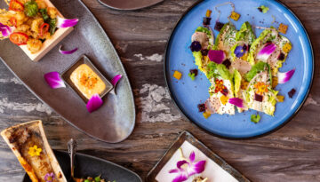 Ariel view of lavish fish and bone marrow dihes from JK by Chef King