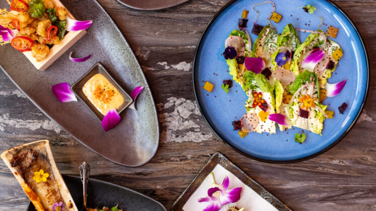 Ariel view of lavish fish and bone marrow dihes from JK by Chef King