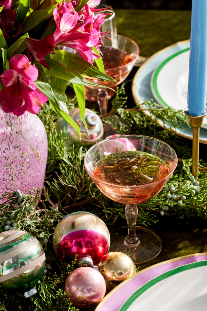 A non-traditional tablescape with hues of pink, blue and green.