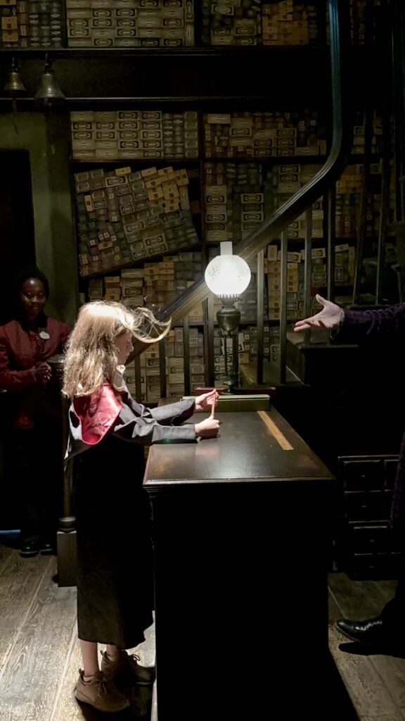 Photo of a girl choosing a wand at Ollivander's in Universal Studios Hollywood