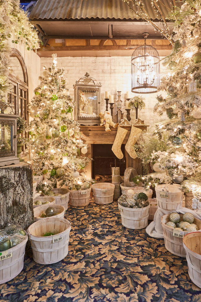 Festive room with christmas lights, stockings, and a christmas tree