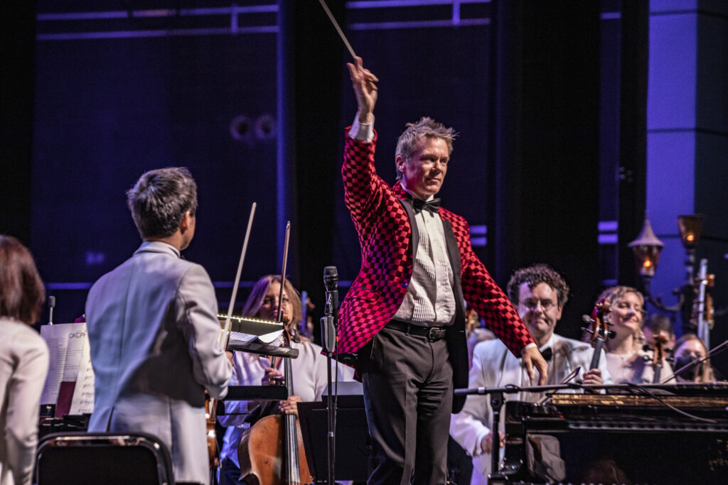 Oklahoma City Philharmonic Maestro Alexander Mickelthwate conducting the Christmas concert.