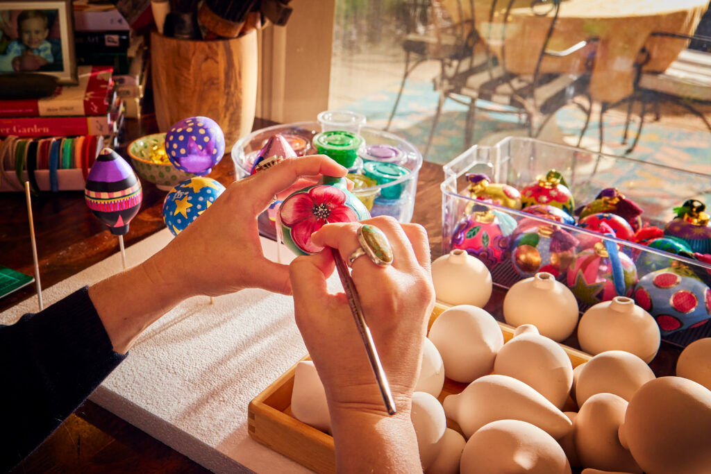 Natalie Miller hand paints ornaments for her brand Natalie Miller Arts in Oklahoma.