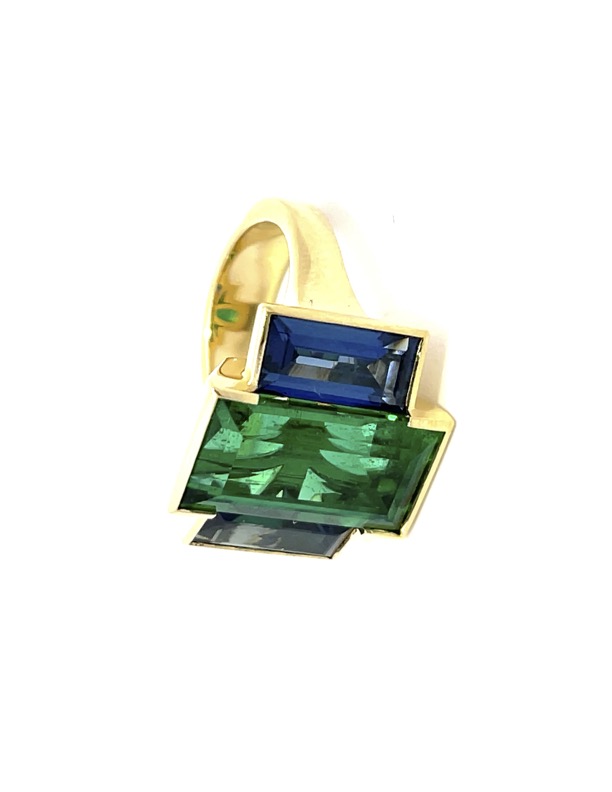 Ring with three green and blue stones