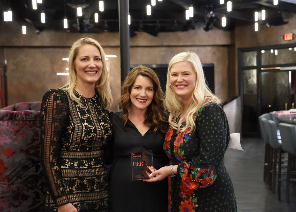 HER Women of the year posing with their award