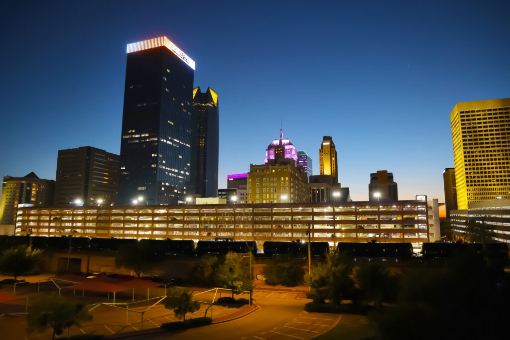 Downtown OKC skyline at dusk on the rooftop of The Clark.