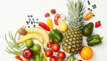 Fresh fruits and vegetables arranged to show healthy living tips for 2024.