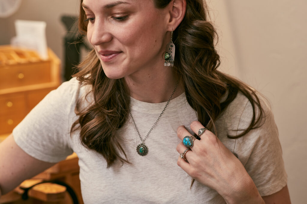 Woman wearing handcrafted sterling silver jewelry