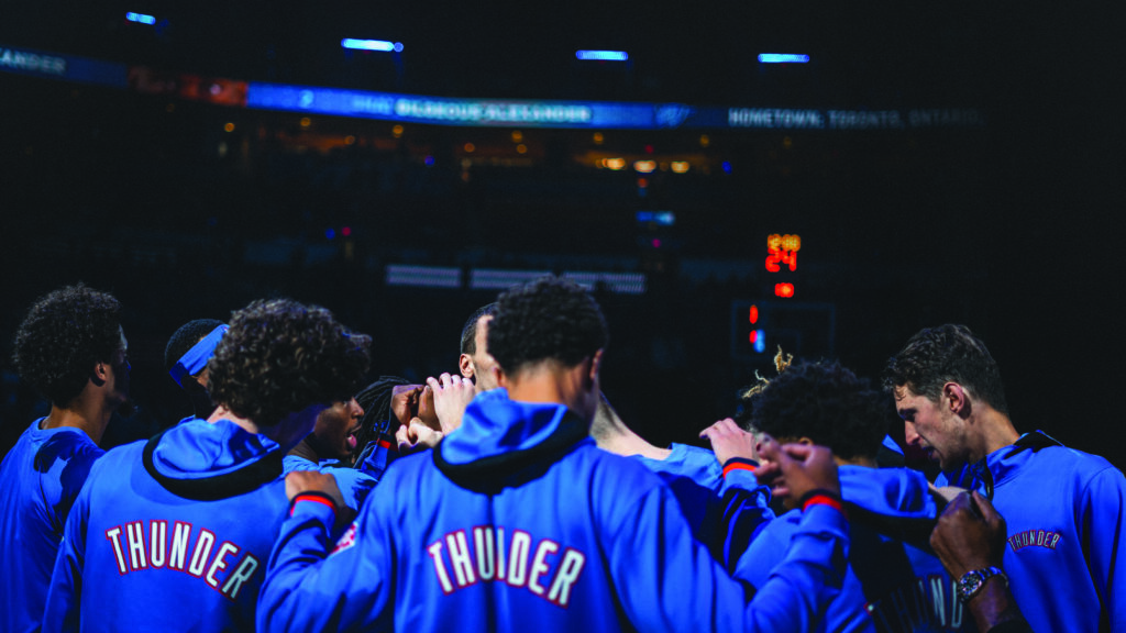 The Oklahoma City Thunder team in a huddle during a game