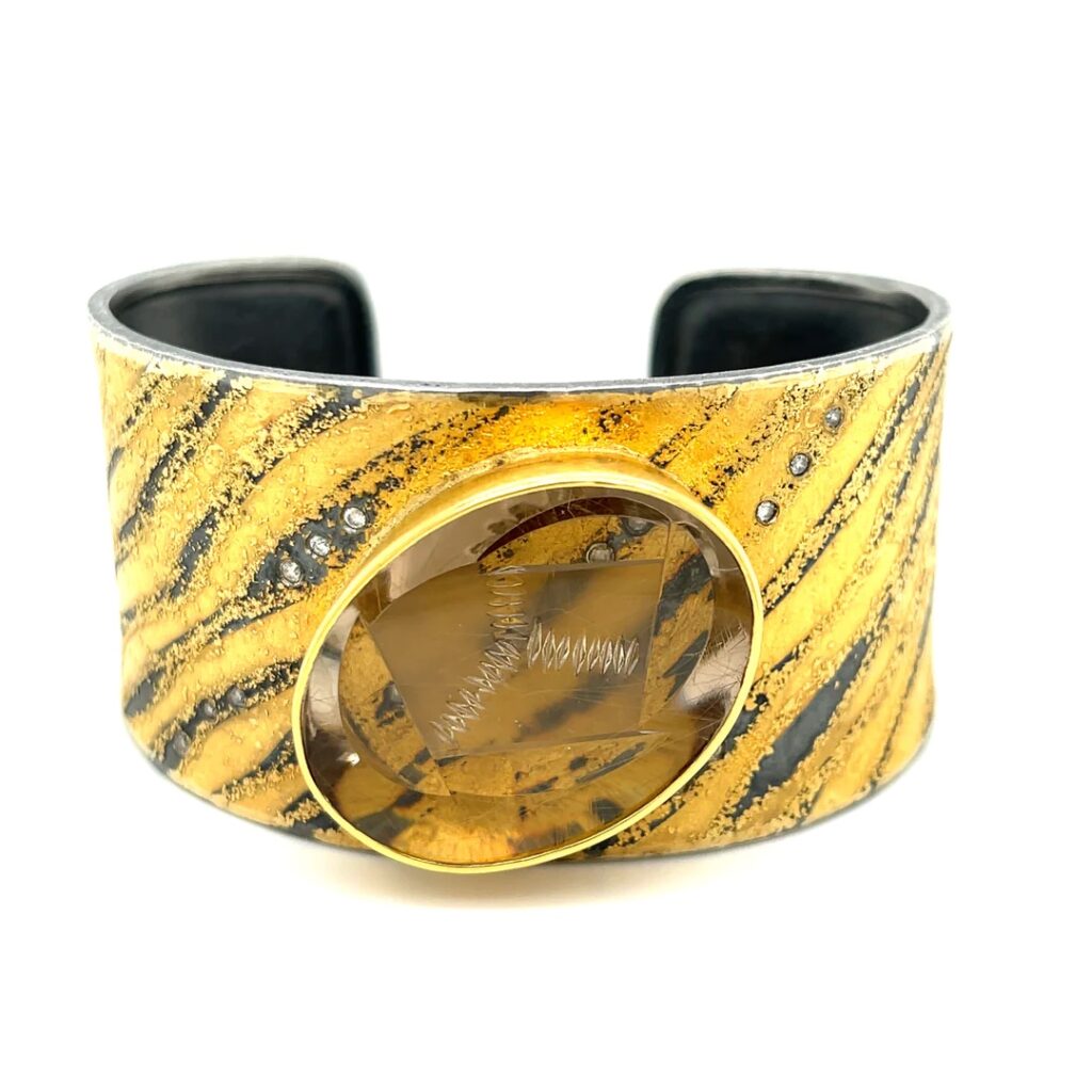 Gold and black quartz cuff with dark yellow stone
