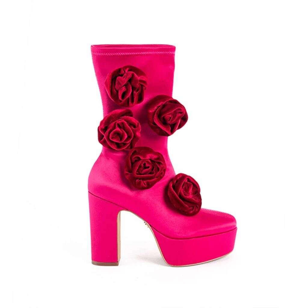 Hot pink heeled boots with rose embellishments