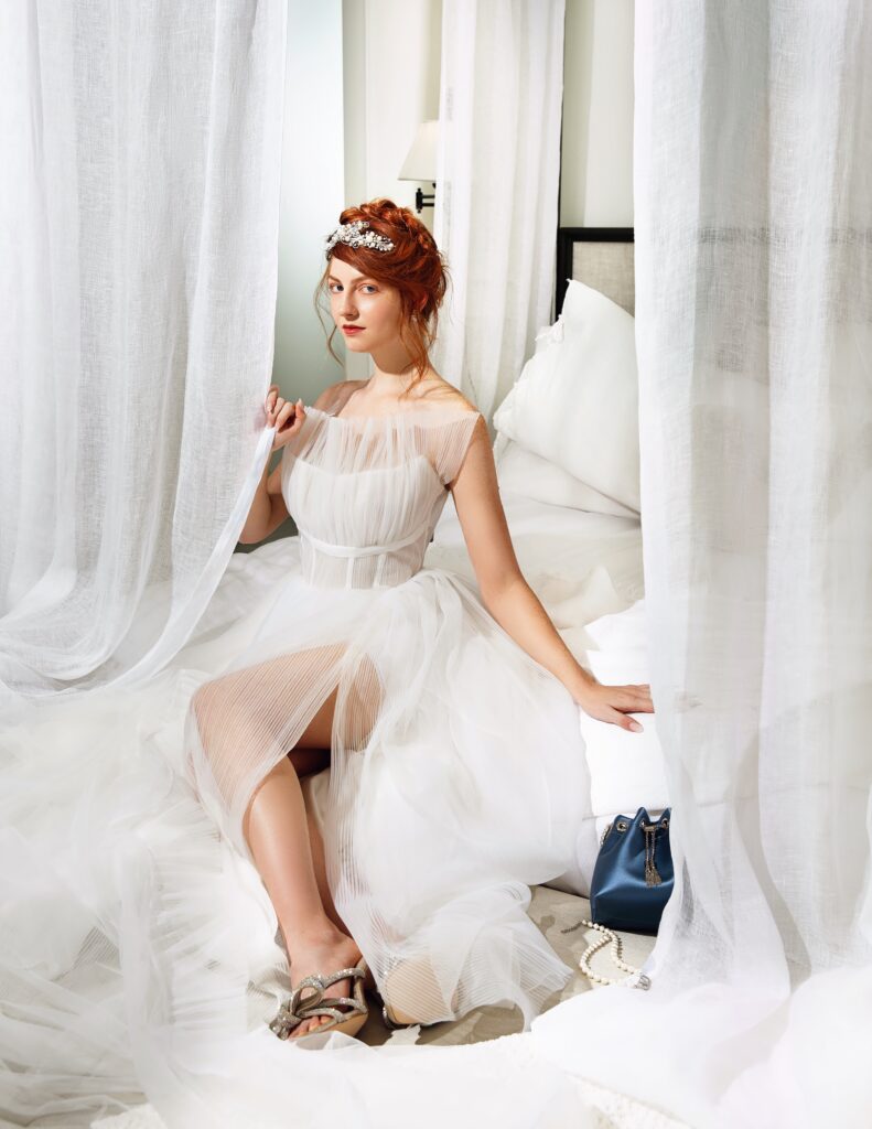 Tara Lauren strapless,pleated tulle gown and earrings from Chantilly Bridal Salon; vintage tiara from Shevaun Williams; ring, Loeffler Randall shoes, Jimmy Choo bag and Valentino necklace from Balliets.