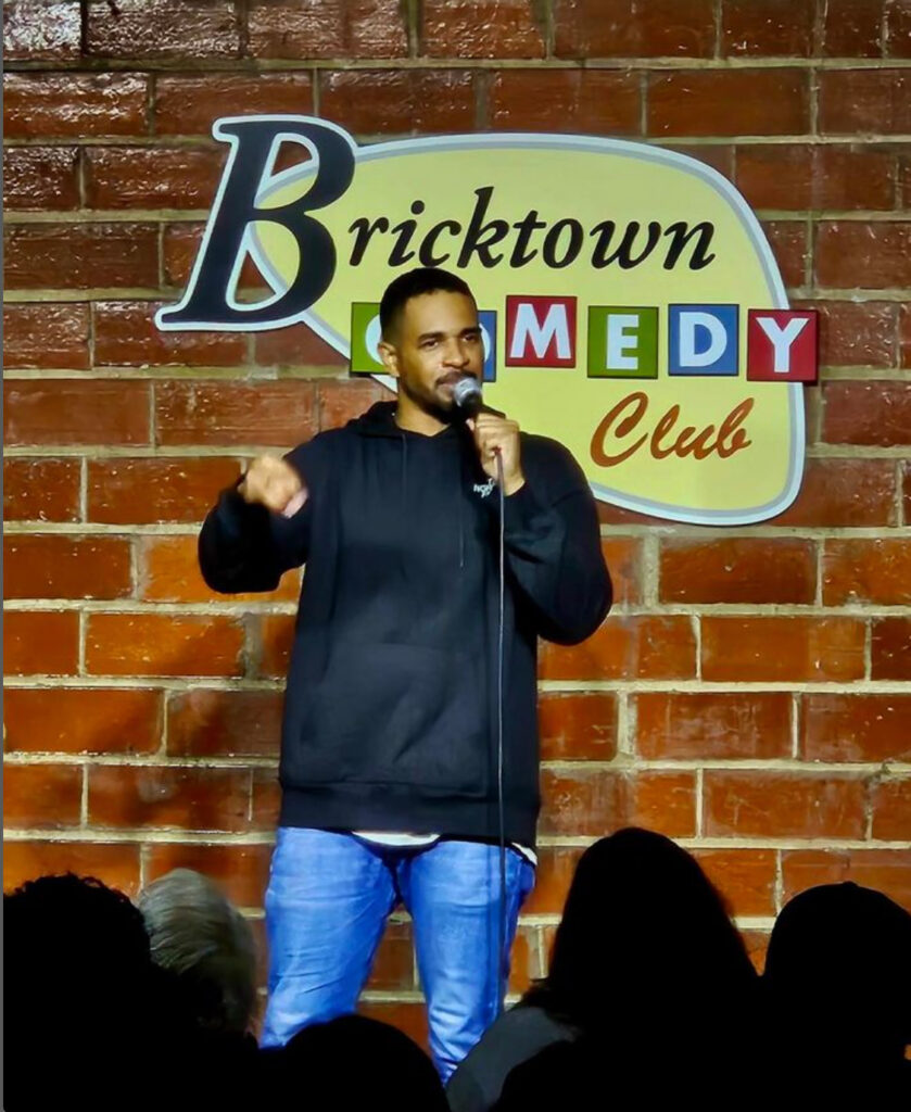 Damon Wayans Jr. performing on stage at Bricktown Comedy Club in Oklahoma City