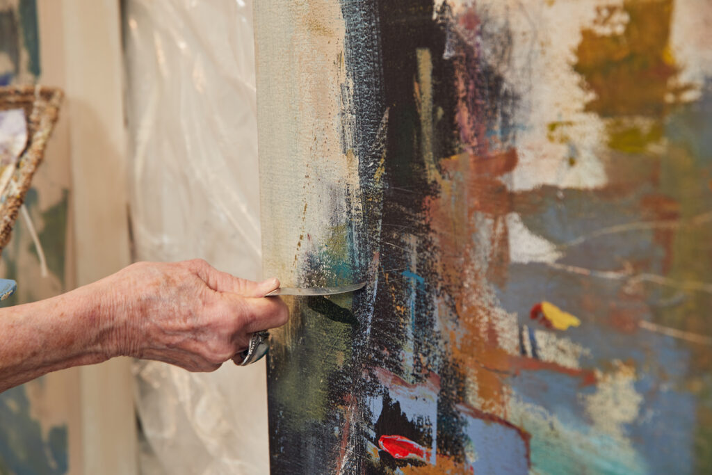 Oklahoma artist Beth Hammack working on a current project in her home studio. Photographed by Charlie Neuenschwander.