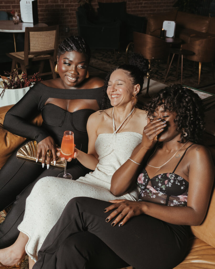 Local influencer and style icon Prisca Editche with Models Madison Jamison and Taylor Emergy lounging at Round Midnight Bar in Edmond. Photo by Chris Rettman. 